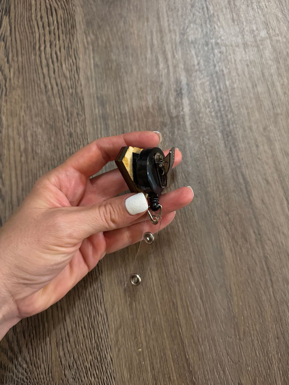 Reel for interchangeable velcro badges
