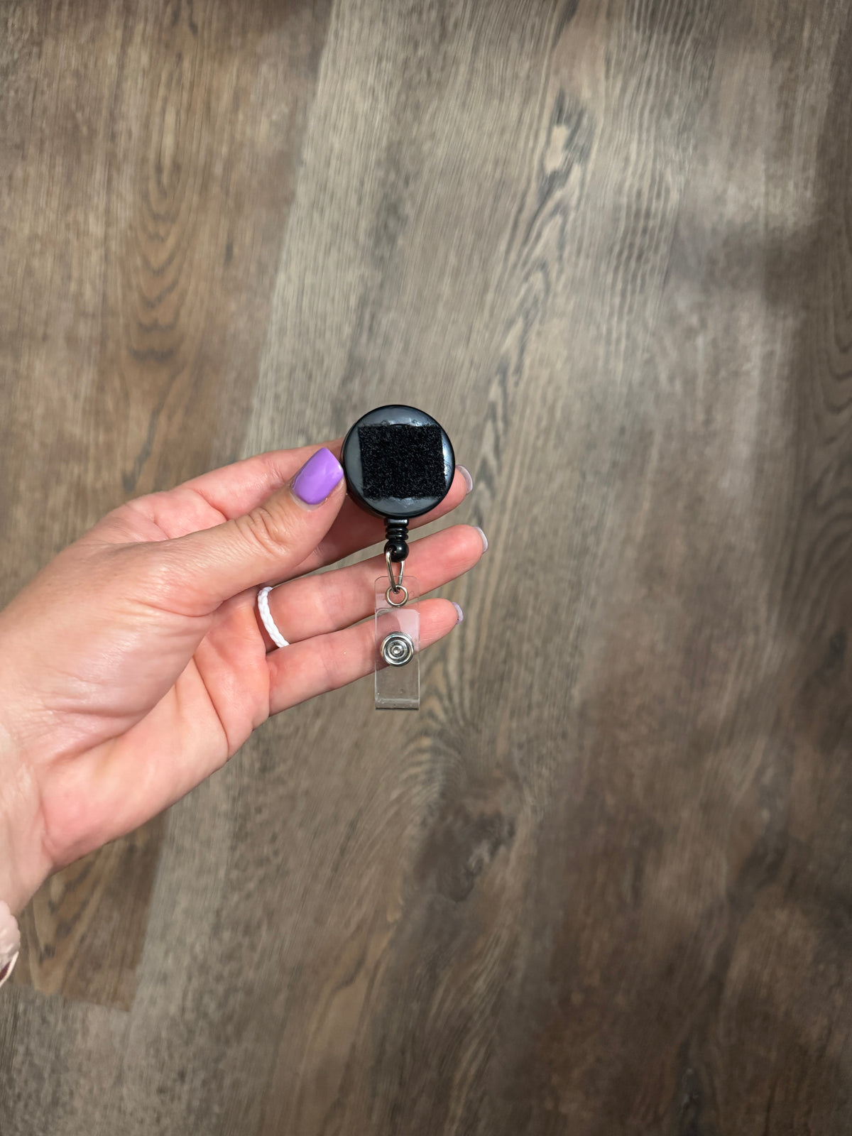 Reel for interchangeable velcro badges