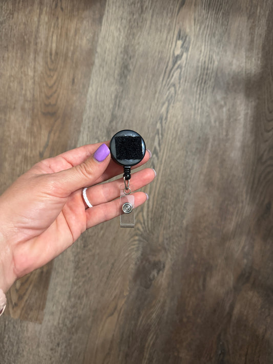 Reel for interchangeable velcro badges